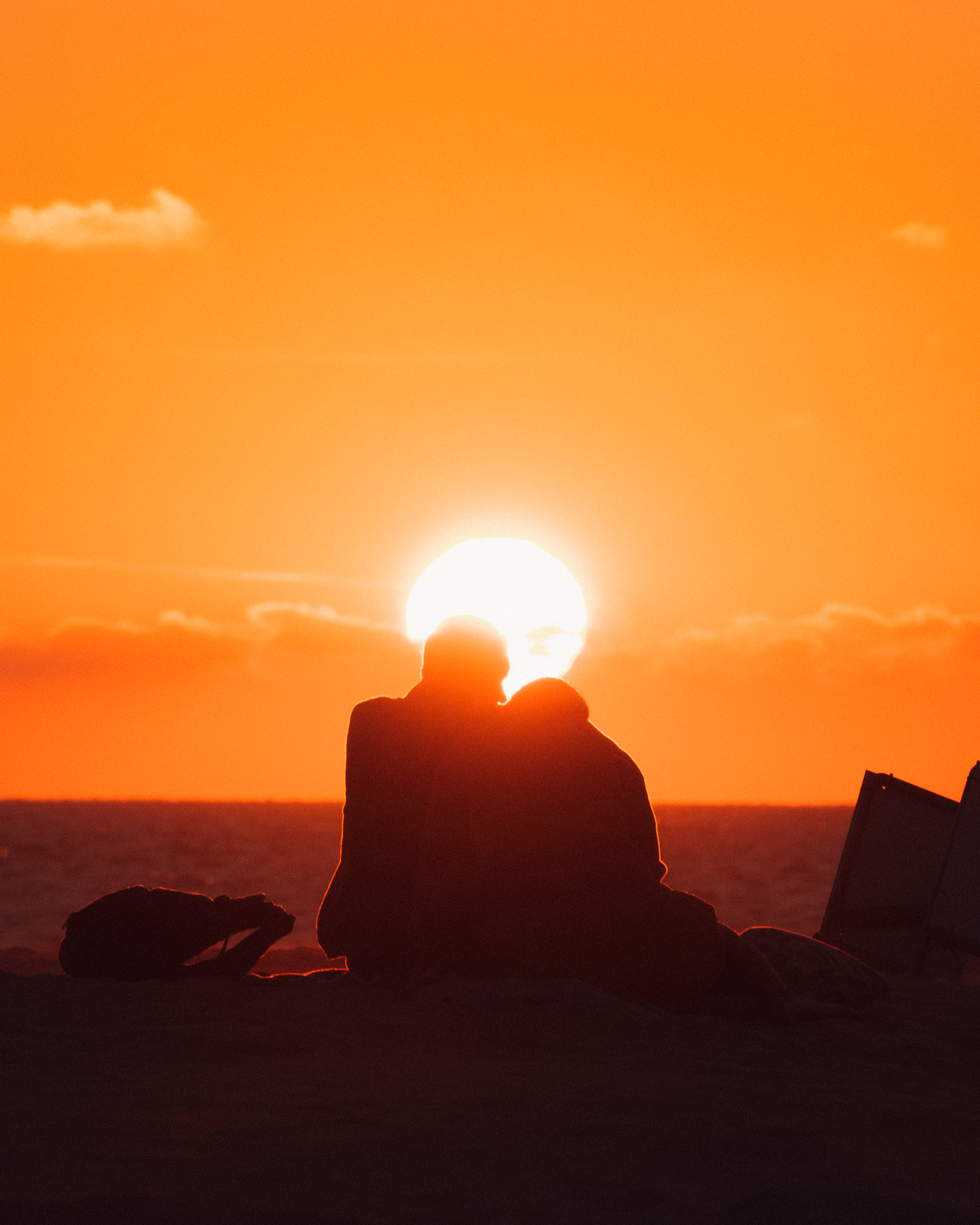 Couple enjoying the sunset on the beach